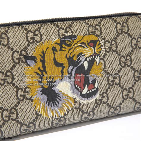 gucci tiger print gg wallet.